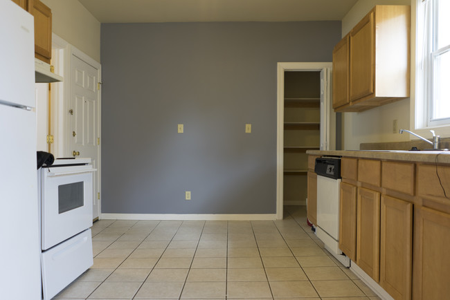 Kitchen with pantry and backdoor exit on left - 724 E Center St