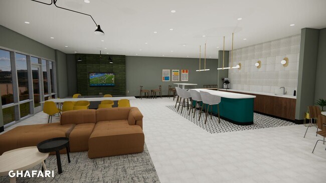 Sala de estar para residentes con asientos y televisión. - Breton 44