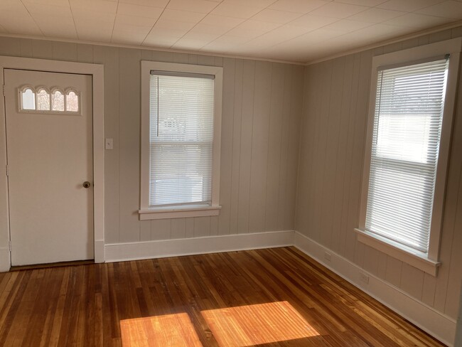 Clean and bright living room with hardwood floors! - 449 Brush Mountain Rd