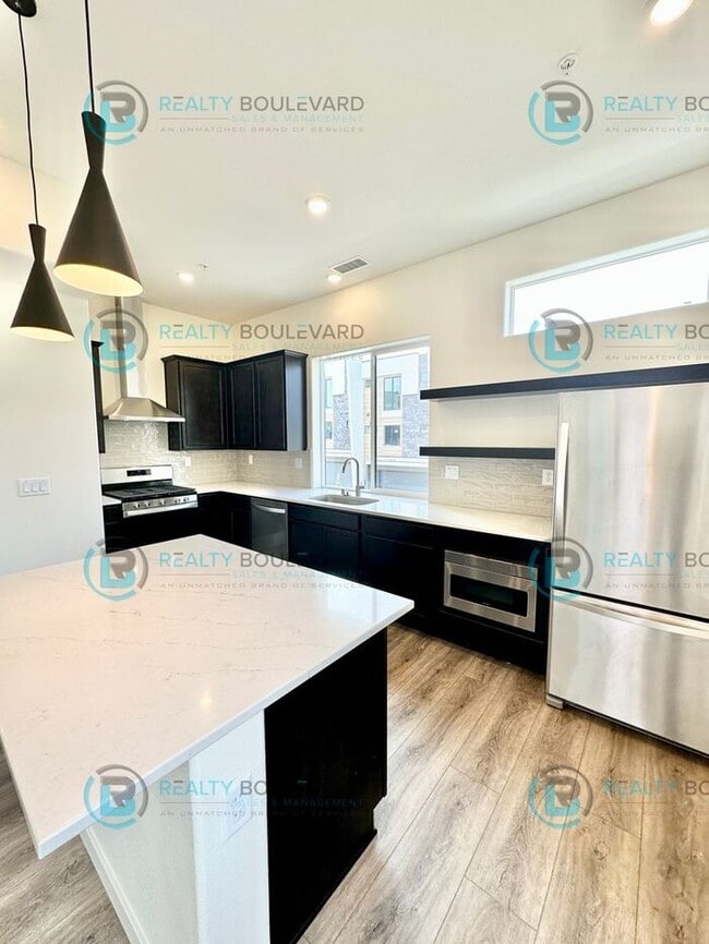 Building Photo - Modern 2 Bedroom 2Bath Townhome with Dual Patios & Designer Finishes near Truckee River