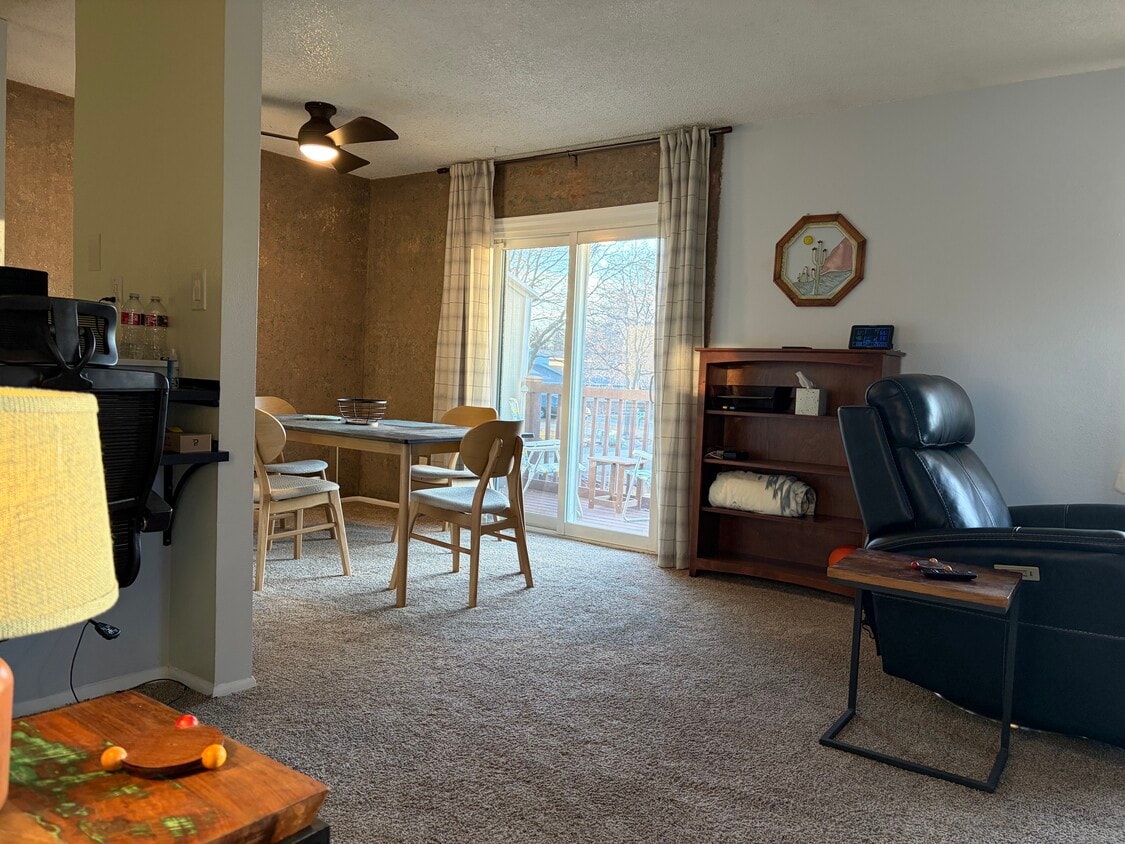 Open living, dining leading to back deck - 1205 Centaur Cir