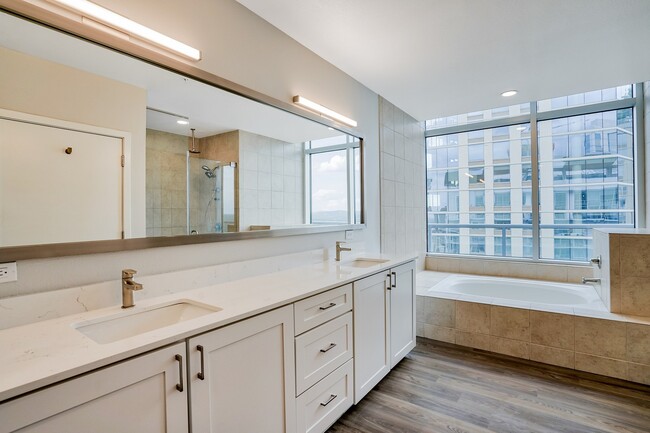 Our penthouse bathrooms are equipped with a double vanity and soaking tub - The Monarch by Windsor