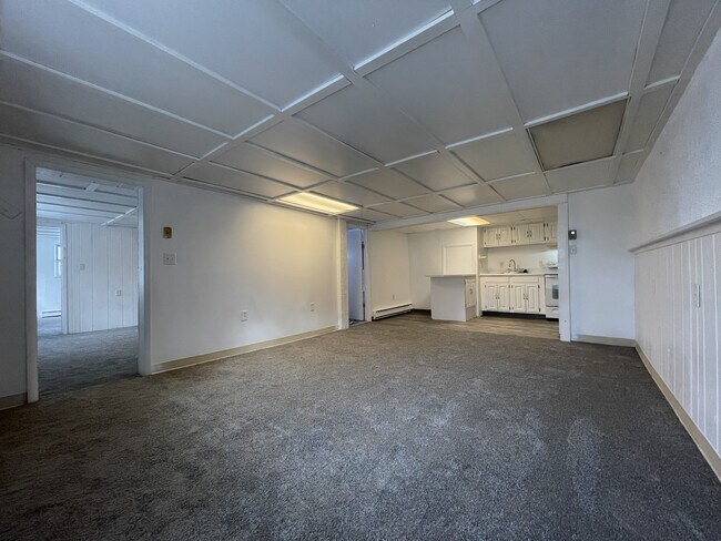 Living room with view of bathroom door - 139 S York Rd