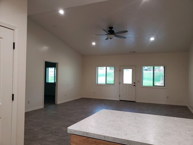 Living room and door to master bedroom - 2100 E Olympic Ave