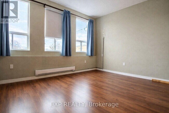 Building Photo - 1038 Coxwell Ave