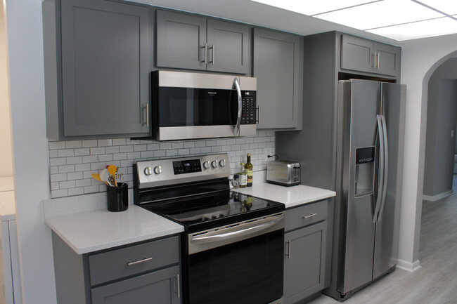 Kitchen (new range, microwave, & fridge) - 2481 12th Ave SW
