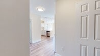 Step into a world of inspiration and tranquility in this exquisite 850 square foot residence. The moment you enter, you're greeted by an abundance of natural light flooding through expansive windows, creating an ambiance of warmth and openness. The living room, with its soaring vaulted ceiling, instantly elevates your sense of space and possibility.

Rich, gleaming hardwood floors flow throughout, providing a seamless connection between rooms and reflecting the quality craftsmanship evident in every detail. The open-concept design invites you to imagine endless possibilities for entertaining or quiet relaxation.

Both bedrooms are thoughtfully appointed, with the primary suite boasting a generous 150 square feet of personal sanctuary. Large windows in each room frame picturesque views of the surrounding landscape, bringing nature's ever-changing canvas right to your doorstep.

The two impeccably designed bathrooms offer a perfect blend of style and functionality. One features a sleek walk-in shower with built-in shelving, while the other boasts a luxurious vanity with a granite countertop, providing ample space for your daily routines.

This home is not just a place to live; it's a gateway to the lifestyle you've always dreamed of. Whether you're hosting friends in the inviting living space, enjoying a quiet morning coffee as sunlight streams through the windows, or retreating to your spacious bedroom at day's end, this residence offers the perfect backdrop for creating cherished memories.

Located in the desirable Union Place community, this home puts you at the center of convenience while providing a peaceful retreat from the outside world. Here, in this thoughtfully crafted space, you'll find more than just a home – you'll discover the inspiration to live your best life.