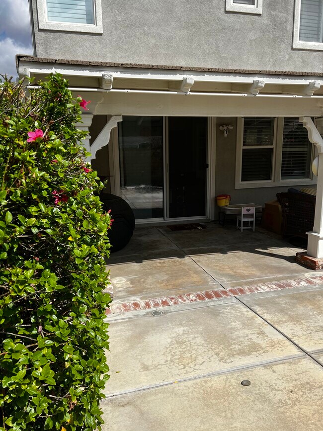 Patio in backyard - 24040 Dandelion Ln