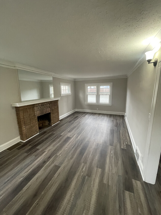 Living room - new vinyl plank flooring throughout entire house - 3377 Silsby Rd