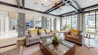 Located at 340 Central Ave in Sarasota, Florida, this single-story clubhouse presents an upscale, amenity-rich environment defined by thoughtful architectural detailing and contemporary interior design. The grand entrance lobby immediately establishes the tone of the space, showcasing soaring barrel-vaulted ceilings, polished marble tile flooring, floor-to-ceiling arched windows, and tiered circular chandeliers that draw the eye upward.

Flowing from the lobby, the main lounge area features coffered ceilings with bold dark wood beams, recessed lighting, and large multi-pane windows that frame outdoor views and flood the interior with natural light. Comfortable seating arrangements with vibrant accent pillows create inviting gathering spaces throughout.

A dedicated billiards and recreation room includes a full-size pool table anchored beneath a sculptural pendant light fixture, a wall-mounted television, a linear fireplace set into a tiled accent wall, and additional seating options. Built-in glass display shelving and curated décor add a refined, gallery-like quality to adjoining areas.

The kitchenette offers gray cabinetry, a subway tile backsplash, stainless steel countertops, an under-counter glass-door refrigerator, and a water purification station. Light wood-look tile flooring in a herringbone pattern ties together the various zones, maintaining a cohesive and polished aesthetic throughout the entire space.
