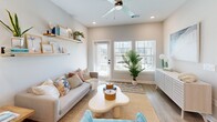 Located at 5001 Willowgate Loop in Fort Myers, FL, this well-designed one-bedroom, one-bathroom home offers a thoughtful single-level layout with a bright, coastal-inspired aesthetic throughout. The open-concept main living area seamlessly integrates the living room, dining space, and kitchen, creating a welcoming and functional hub. The kitchen is outfitted with crisp white cabinetry featuring matte black hardware, stone countertops, stainless steel appliances, and a central island with seating — ideal for casual dining and entertaining. Light wood-look flooring runs throughout the main living areas, enhancing the airy feel. The living room is filled with natural light from large windows and a glass door leading to the private patio, with a ceiling fan adding comfort. The bedroom is a serene retreat with plush carpeting, a ceiling fan, and windows that frame outdoor greenery. The bathroom features wood-look flooring, a glass-enclosed tiled shower, and clean, neutral finishes. Additional conveniences include a dedicated laundry area, three closets providing ample storage, and an entrance foyer. The home's cohesive neutral palette and abundant natural light give the space a warm, relaxed Florida feel.