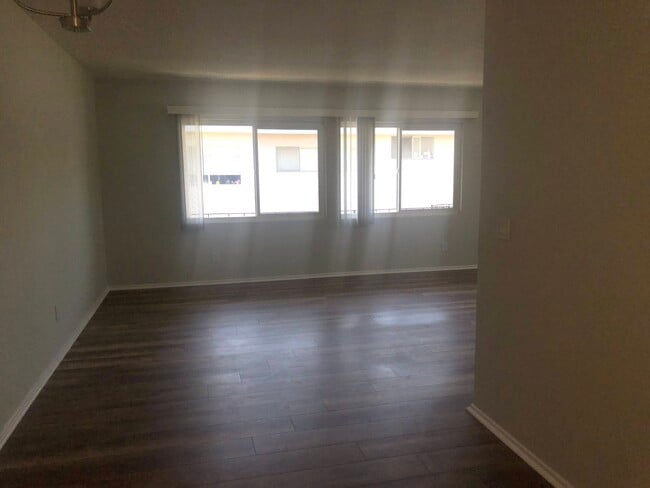 Large living area with lots of windows - 7808 W Manchester Ave