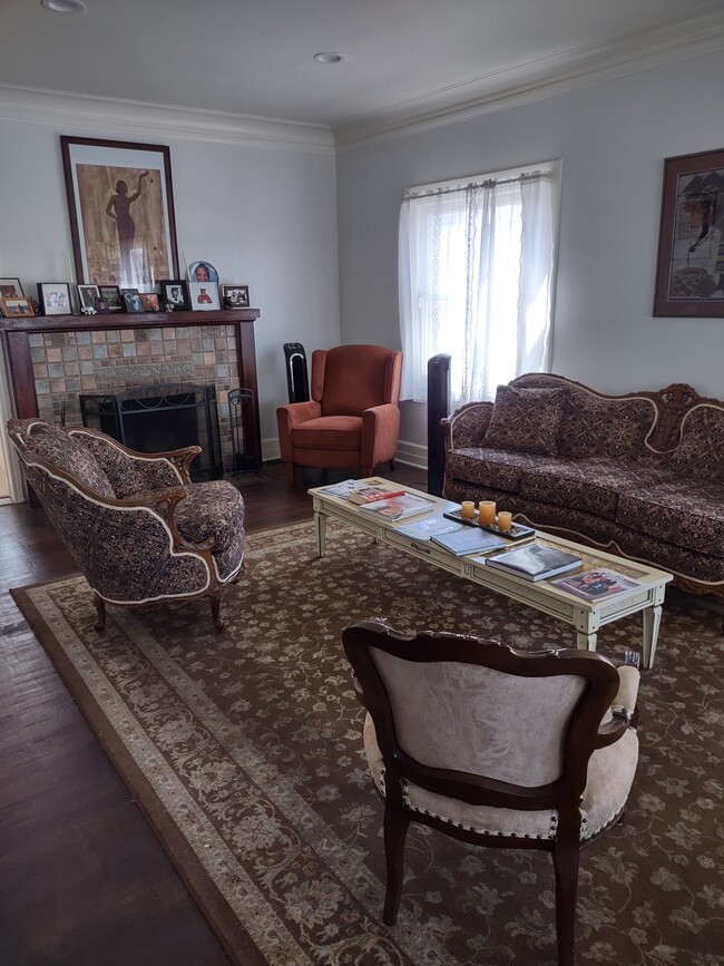 Living Room. The Furniture will be swapped out for new furniture if you want the home furnished. - 2142 S Victoria Ave