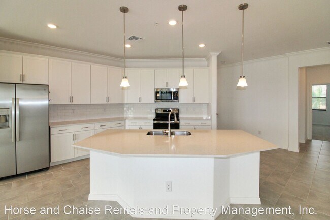 Foto del edificio - 2 br, 2 bath House - 10213 Staggerbush Dr ...