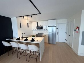 Building Photo - Cosmo440 Luxury Apartments