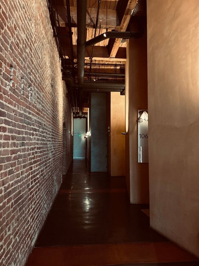 Building Photo - EXQUISITE BRICK & TIMBER LIVE/WORK LOFT IN...