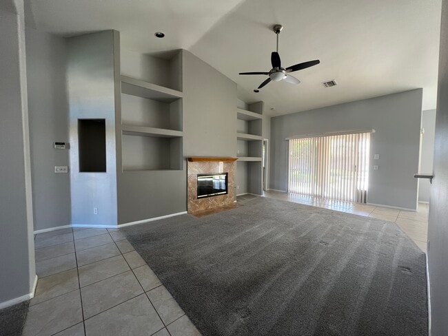 Family living room with high ceilings and fireplace - 30775 Avenida del Yermo