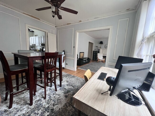 Dining room with table, living room beyond - 560 Sheridan Sq