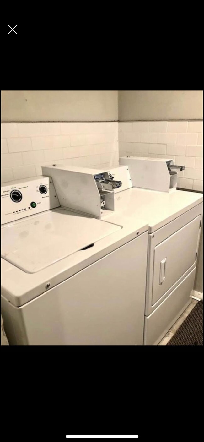 Laundry in the second floor hallway outside in the hallway of this unit - 912 Centre St