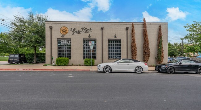 Building Photo - Stylish Downtown 1BR: Modern Comfort Meets...