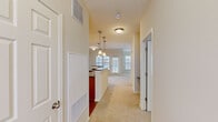 Located at 4800 Alexander Valley Dr in Charlotte, NC, this one-bedroom, one-bathroom residence offers a well-organized single-floor layout with a comfortable and functional design throughout. The open-concept living area flows seamlessly from the kitchen through the dining space and into the living room, which is brightened by large windows overlooking lush greenery. The kitchen is equipped with warm-toned wood cabinetry, dark granite-style countertops, black appliances including a refrigerator, range, microwave, and dishwasher, and hardwood-style flooring. A curved peninsula with pendant lighting above serves as a natural divider between the kitchen and the adjoining dining and living areas, which feature plush neutral carpeting. The spacious primary bedroom is appointed with elegant crown molding, soft carpet, and generous natural light from multiple windows with views of surrounding trees. The full bathroom includes a tiled soaking tub and shower combination, a vanity with white countertop, and tile flooring. Throughout the residence, a neutral color palette and consistent finishes create a clean, cohesive ambiance suited for comfortable everyday living.