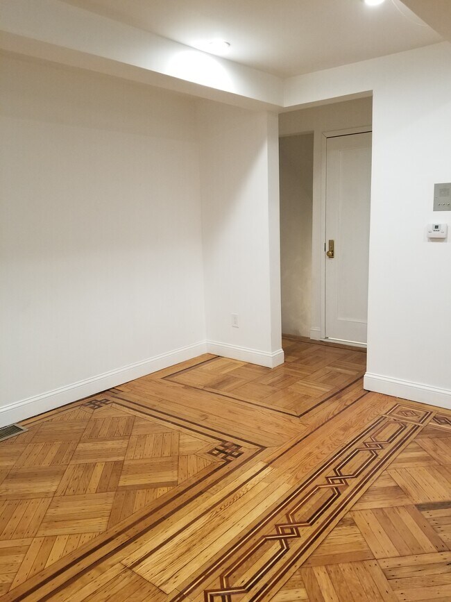 View of entry area and access to lower floor from living room. - 135 6th Avenue