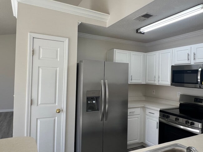 Building Photo - ONE MONTH FREE with an eighteen-month lease. Spacious, Three-Bedroom Home with Fenced Yard! Just ...