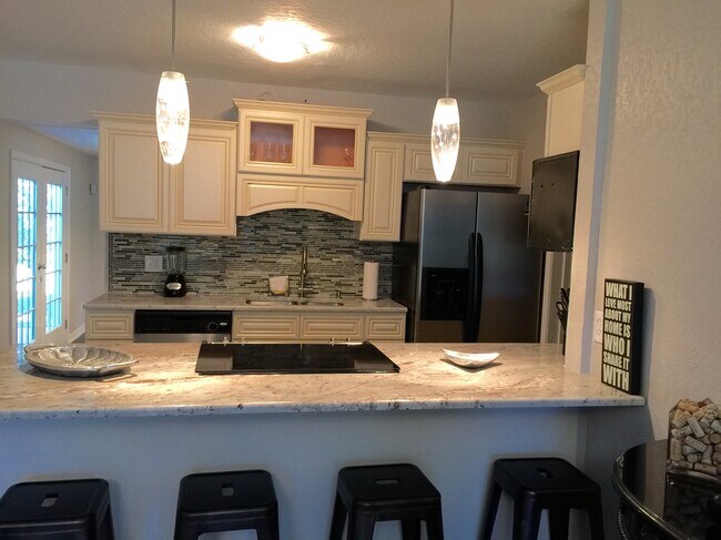 Kitchen with island - 126 Jade Dr