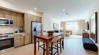 Located at 25440 Solaris Pl in Murrieta, California, this well-appointed two-bedroom, three-bathroom residence offers a thoughtfully designed single-floor layout with a clean, contemporary aesthetic. Light wood-style flooring flows consistently throughout, tying each space together with warmth and cohesion.

The open kitchen is a standout feature, showcasing warm wood cabinetry with matte black hardware, a textured tile backsplash, stainless steel appliances including a range, microwave, dishwasher, and refrigerator, and ample counter space. It connects seamlessly to a dining area, making it ideal for everyday living and entertaining.

The living room is bright and inviting, with large windows and balcony access that allow generous natural light to fill the space. Recessed lighting and neutral walls create a versatile backdrop for a range of interior styles.

The primary bedroom is generously sized, featuring a ceiling fan, a large window with outdoor views, and dedicated closet space. The second bedroom is equally well-lit, with natural light from surrounding windows and a full-length wall mirror that enhances the sense of space.

The three bathrooms are clean and functional, with tub-shower combinations featuring white subway tile surrounds, built-in shelving, and light wood flooring. A hallway connects the bedrooms and bathrooms, adding to the home's efficient and comfortable flow.