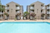 Located at 3801 West Napoleon Avenue in Metairie, Louisiana, this compact 360-square-foot, one-bedroom, one-bathroom apartment is thoughtfully laid out across a single floor to maximize every inch of available space. The living room features carpeted flooring, a wall-mounted HVAC unit, and a sliding glass door that invites natural light into the room. The kitchen is equipped with a refrigerator, electric range, and a breakfast bar with countertop seating, finished with light tile flooring for easy maintenance. The 110-square-foot bedroom offers carpeted flooring, a ceiling fan, a mirrored sliding-door closet providing ample storage, and a window dressed with patterned curtains and a privacy shade. The bathroom and a dedicated laundry area round out the unit's functional layout. Throughout the apartment, warm neutral tones on the walls and soft carpeting in the main living areas create a cohesive and comfortable atmosphere. The efficient floor plan makes this apartment an ideal option for a single occupant or couple seeking a practical, move-in-ready residence in the Metairie area.
