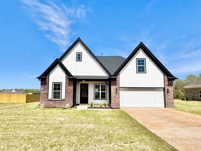 Building Photo - Now Leasing a 4 bedroom 2.5 bath home with...