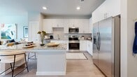 Located at 10191 Main St in Houston, TX, this thoughtfully designed one-bedroom, one-bathroom residence offers an efficient and comfortable single-floor layout. The open-concept living area seamlessly connects the kitchen, dining, and living spaces, creating a bright and welcoming atmosphere with light wood-style flooring throughout.

The kitchen is a standout feature, showcasing crisp white cabinetry extending to the ceiling, a neutral subway tile backsplash, granite countertops, and a full suite of stainless steel appliances including a refrigerator with ice maker, electric range, and built-in microwave. A peninsula island with granite counters provides additional prep space and casual seating, making it ideal for both cooking and entertaining. A pantry adds generous storage nearby.

The bedroom is a restful retreat featuring a large window that welcomes natural light and offers exterior views. Two closets provide ample storage. The bathroom is finished with wood-style flooring, a tiled soaking tub and shower combination, and granite-topped vanity. A dedicated laundry area adds everyday convenience. The entrance and hallway provide a clean transition throughout the space, completing this well-planned Houston residence.