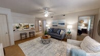 Located on E Valley Water Mill Rd in Springfield, MO, this single-floor residence offers a thoughtfully designed layout that balances comfort and functionality. The living room serves as the heart of the home, featuring a textured ceiling, a ceiling fan with integrated lighting, and neutral warm-toned walls that create a bright and inviting atmosphere. Natural light filters in through window blinds, complementing the mix of hardwood-style and carpeted flooring. The space flows seamlessly into a breakfast bar area, ideal for casual dining or entertaining.

The galley-style kitchen is efficiently laid out with ample white cabinetry, generous counter space, light tile flooring, and essential appliances including an electric range, microwave, and dishwasher. A doorway connects the kitchen directly to additional areas of the home for easy circulation.

The residence includes two bedrooms, each featuring ceiling fans, carpeted floors, and windows that bring in soft natural light. Both rooms offer comfortable proportions suitable for a full bedroom suite setup.

The full bathroom is finished with light tile flooring, a combined tub and shower enclosed with sliding glass doors, a single-sink vanity with built-in cabinetry, and a textured ceiling with ventilation. The overall aesthetic throughout the home is clean, neutral, and move-in ready.