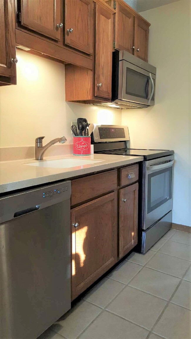 Kitchen with stainless steel appliance - 23243 Rosewood Ct