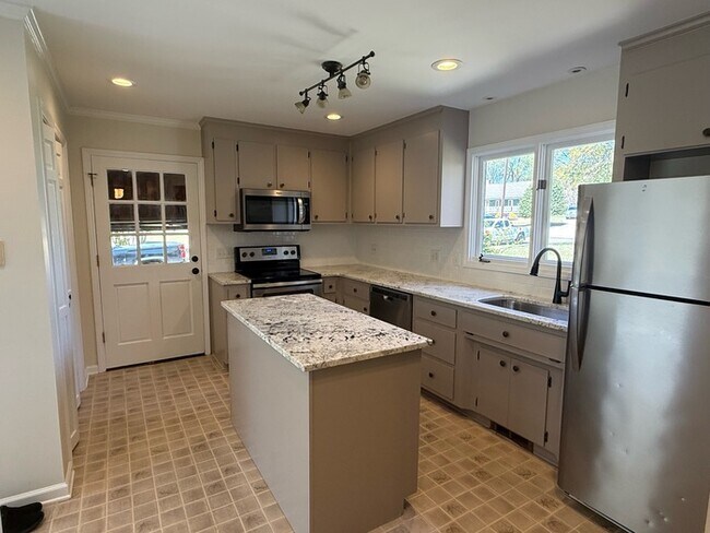 Building Photo - Spacious ranch, fenced yard, 2 car garage, large basement, near Wake Tech