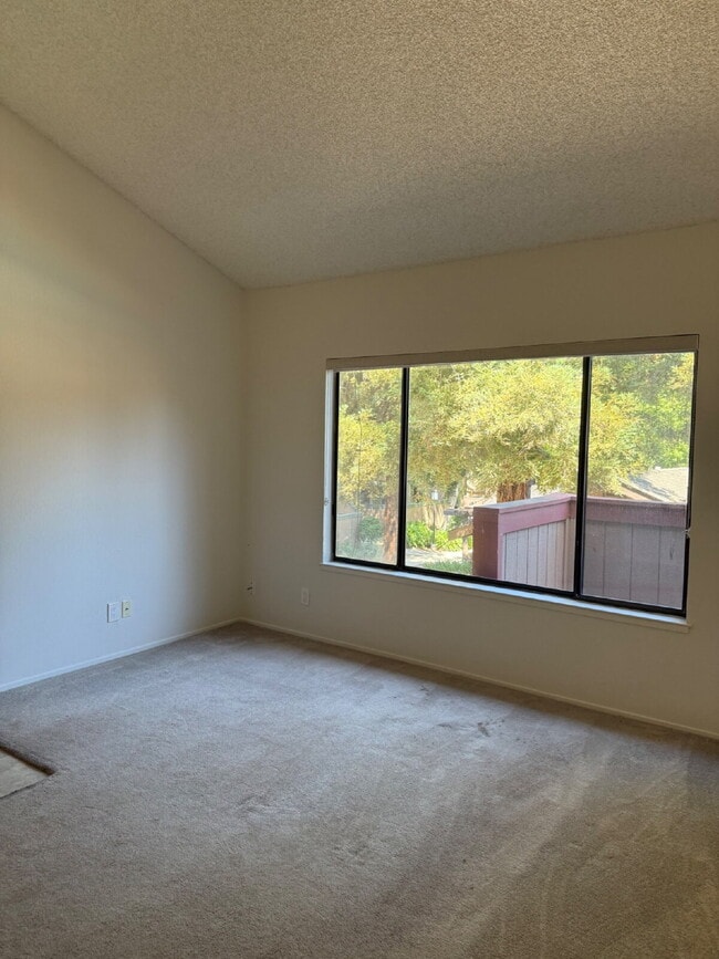 Building Photo - Spacious 3-Bedroom, 2-Bath Multi-Level Home with Balcony, In-Unit Laundry & Dual Parking