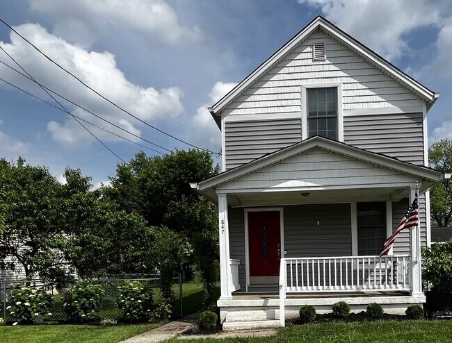 Large fenced-in side yard with concrete patio - 847 Elm St