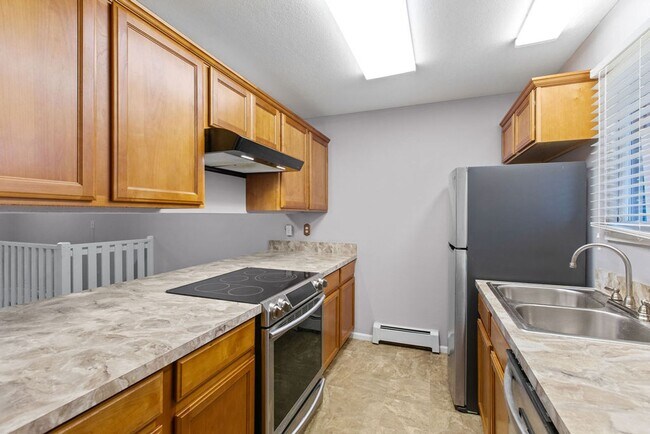 Foto del edificio - Spacious 2-Bedroom Condo with Garage and Basement