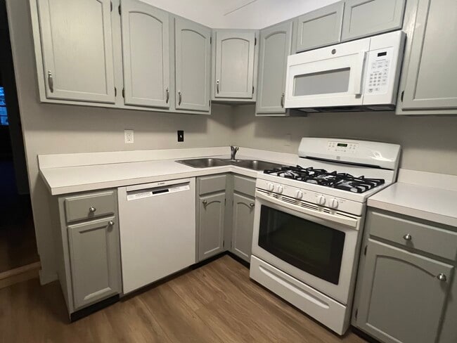 Kitchen with gas stove and new Bosch dishwasher and GE microwave, 2 sink w/ disposal - 347 Elliot St