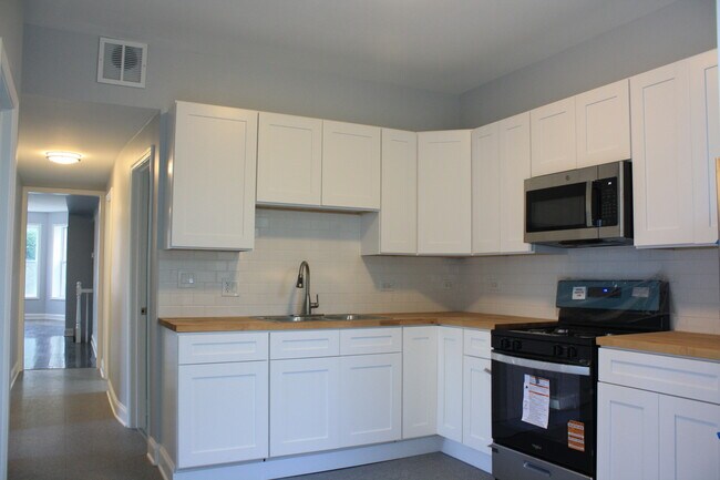 Building Photo - 6433 S Vernon Ave
