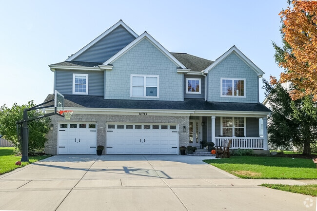 Two story home with front porches and attached garages are all over South Huntley.