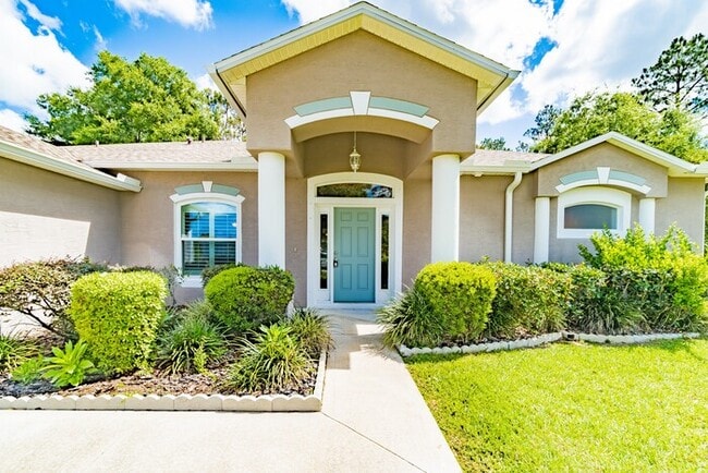 Building Photo - "Discover Unrivaled Living: Your Palm Coas...