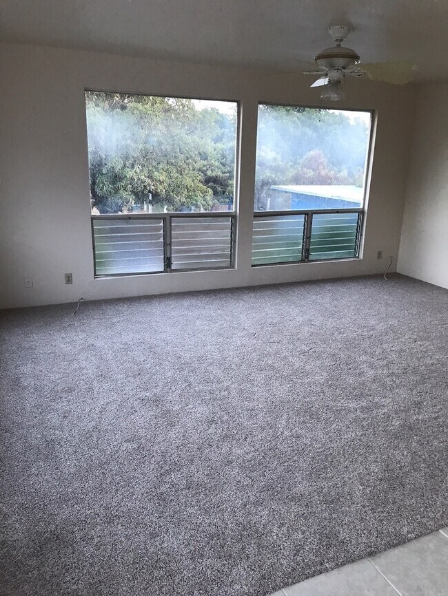 Building Photo - Partly Furnished 3 Bedroom 2 bath Attached...