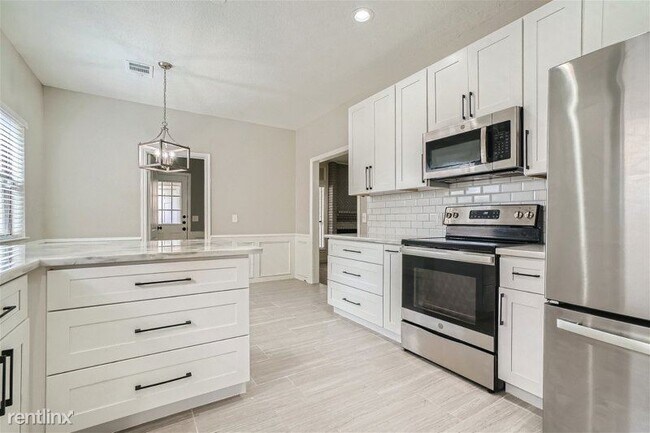 Foto del edificio - 4 br, 2.5 bath House - 8603 Joggers Lane UNIT
