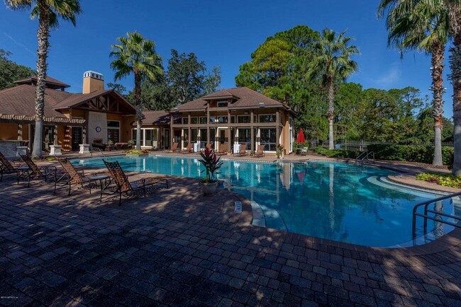 Relax and unwind lounging by one of two, beautiful pools. - 100 Fairway Park Blvd