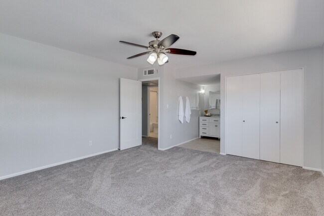 master bedroom, closet and view to on suite master bath - 6030 N 15th St