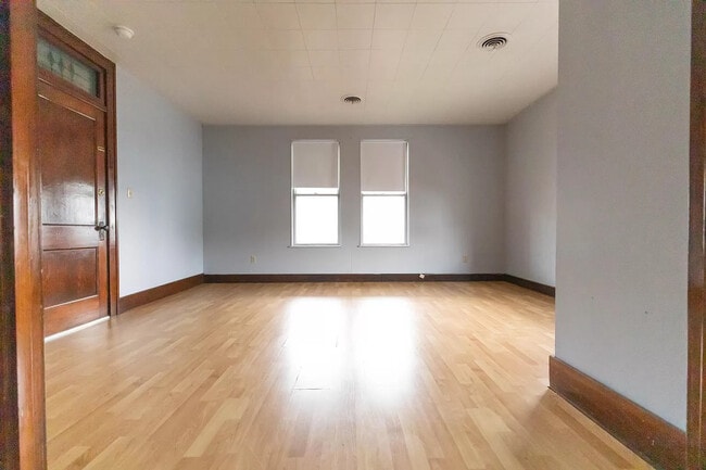 Main bedroom 17 x 14. Nice size closet, and working (original) pocket doors. (pic 1 of 2) - 700 1/2 Morgantown Ave