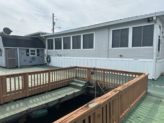 Building Photo - "Cozy and Convenient Water Front 2-Bedroom...
