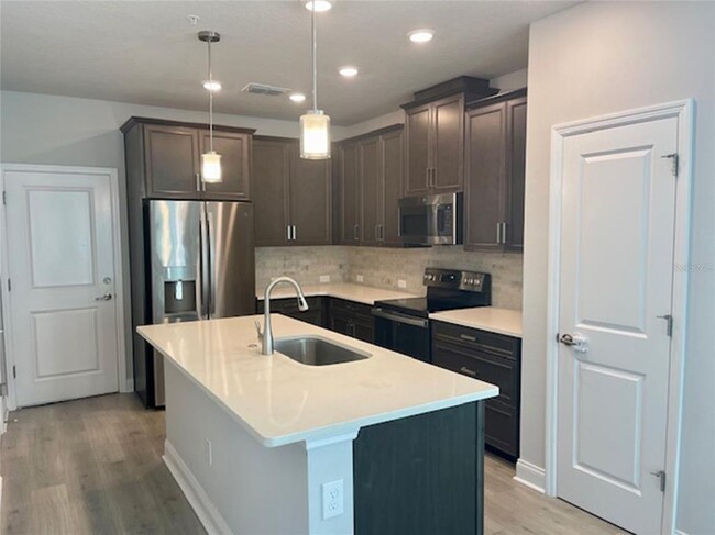 Building Photo - 8669 Tavistock Lakes Blvd