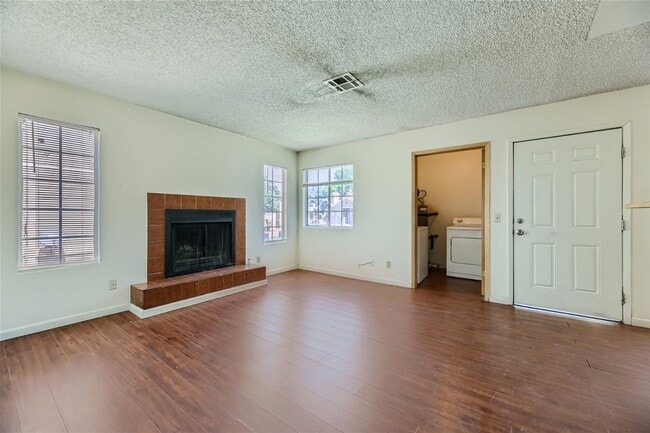 Building Photo - 2nd Story 2-Bed Condo with Tile Fireplace